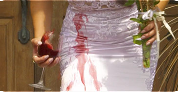 Woman spilling wine on her wedding dress